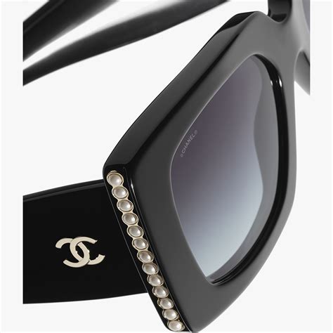 chanel sunglasses with pearls on the side|Chanel sunglasses with white trim.